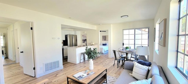 742 Eastshore, Chula Vista, CA 91913 - living area featuring healthy amount of natural light, light wood finished floors, and baseboards