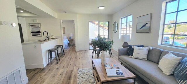 742 Eastshore, Chula Vista, CA 91913 - living room with baseboards and light wood finished floors
