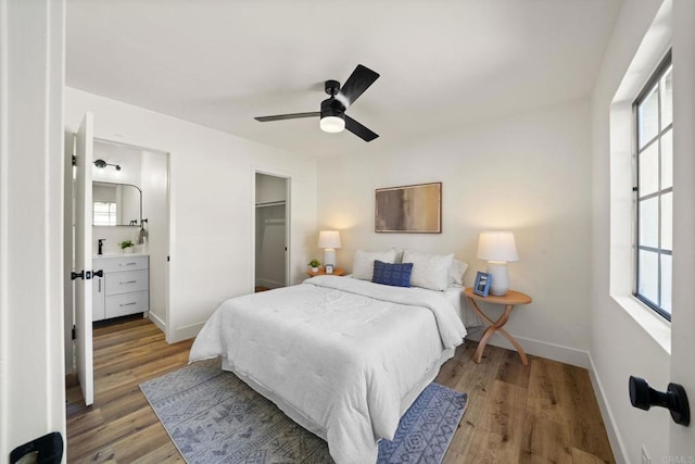 742 Eastshore, Chula Vista, CA 91913 - bedroom with light wood-style floors, baseboards, a ceiling fan, and a spacious closet