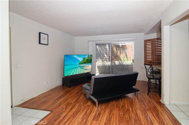 28948 Marilyn Dr, Canyon Country, CA 91387 - living room with a textured ceiling, wood finished floors, and baseboards