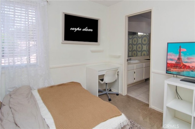 28948 Marilyn Dr, Canyon Country, CA 91387 - bedroom with light colored carpet, ensuite bath, and a sink