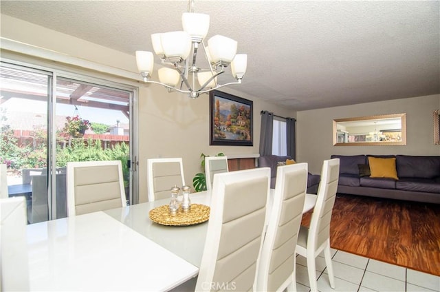 28948 Marilyn Dr, Canyon Country, CA 91387 - dining room with a chandelier, a textured ceiling, and tile patterned flooring