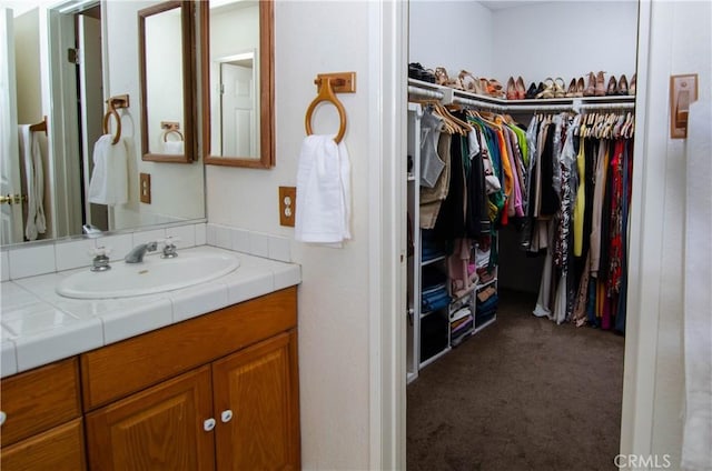 28948 Marilyn Dr, Canyon Country, CA 91387 - bathroom featuring vanity and a spacious closet