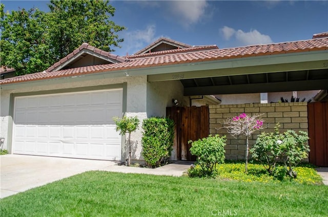 28948 Marilyn Dr, Canyon Country, CA 91387 - view of front of home featuring an attached garage, driveway, stucco siding, and a tiled roof
