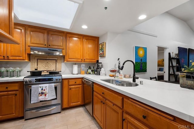 270 Cagney Ln Unit 315, Newport Beach, CA 92663 - kitchen featuring stainless steel appliances, a sink, brown cabinetry, light countertops, and recessed lighting