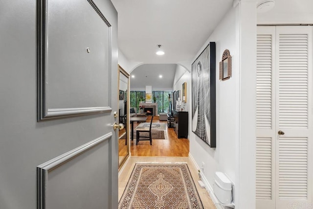 270 Cagney Ln Unit 315, Newport Beach, CA 92663 - corridor featuring recessed lighting, light wood-type flooring, and arched walkways