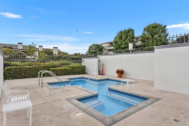 270 Cagney Ln Unit 315, Newport Beach, CA 92663 - view of pool with a hot tub and a patio