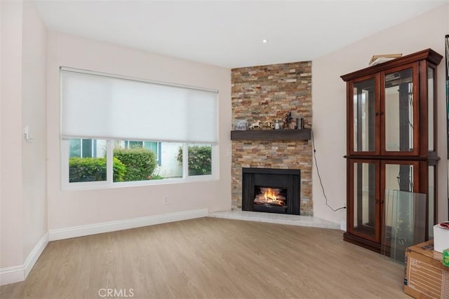 3404 Los Mochis Way, Oceanside, CA 92056 - unfurnished living room with wood finished floors, a fireplace, and baseboards