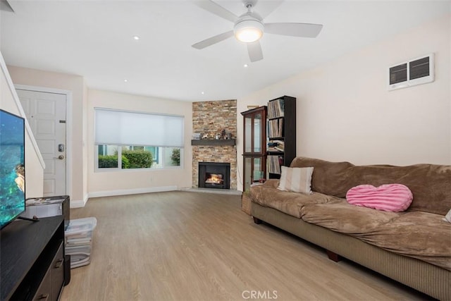 3404 Los Mochis Way, Oceanside, CA 92056 - living room featuring light wood-style flooring, ceiling fan, a fireplace, and baseboards