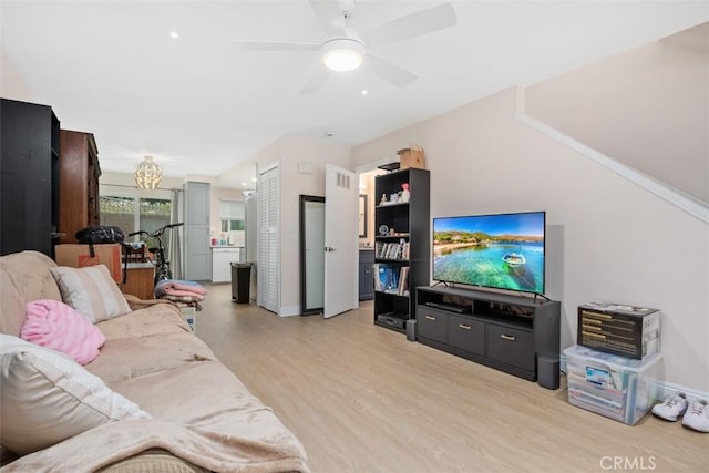 3404 Los Mochis Way, Oceanside, CA 92056 - living area featuring light wood-style floors, baseboards, a ceiling fan, and a chandelier