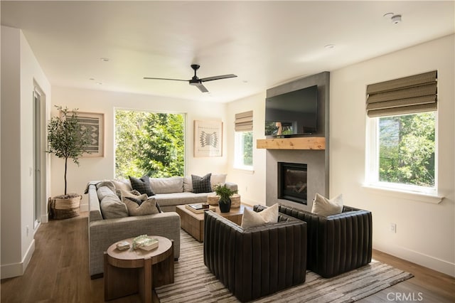 357 Mittry Ln, Lake Arrowhead, CA 92352 - living room with baseboards, a glass covered fireplace, wood finished floors, and ceiling fan