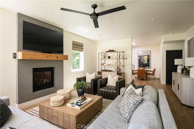 357 Mittry Ln, Lake Arrowhead, CA 92352 - living room with a ceiling fan, wood finished floors, a fireplace, and baseboards