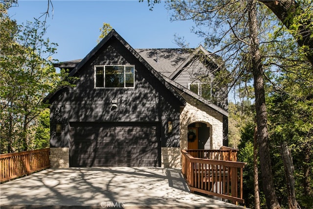 357 Mittry Ln, Lake Arrowhead, CA 92352 - view of front facade featuring concrete driveway and stone siding