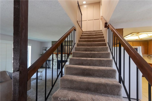 949 W Imperial Blvd Unit 14C, La Habra, CA 90631 - staircase featuring a textured ceiling and carpet flooring