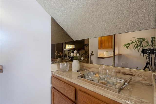 949 W Imperial Blvd Unit 14C, La Habra, CA 90631 - bar featuring a textured ceiling