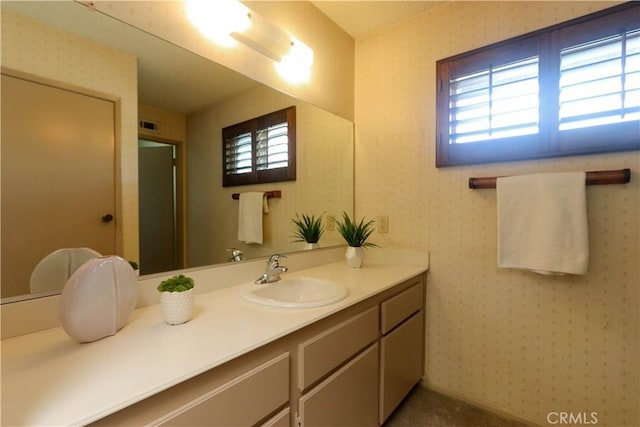 949 W Imperial Blvd Unit 14C, La Habra, CA 90631 - bathroom with healthy amount of natural light, vanity, and wallpapered walls