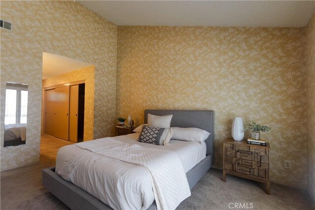 949 W Imperial Blvd Unit 14C, La Habra, CA 90631 - bedroom with wallpapered walls, a closet, and carpet