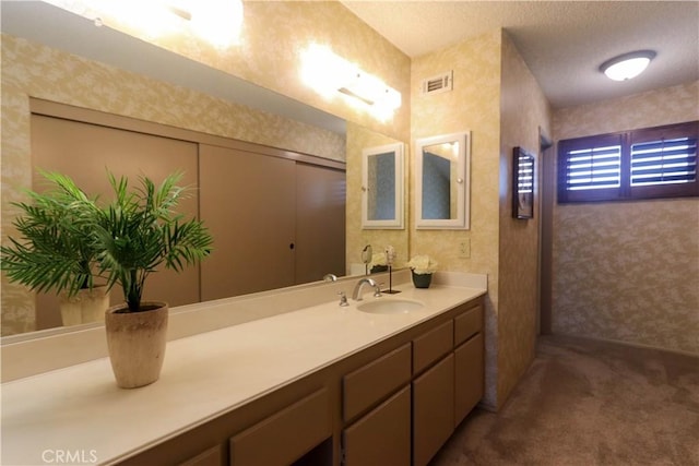 949 W Imperial Blvd Unit 14C, La Habra, CA 90631 - bathroom featuring vanity, wallpapered walls, and a textured ceiling