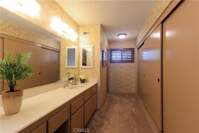 949 W Imperial Blvd Unit 14C, La Habra, CA 90631 - bathroom with a textured ceiling and vanity