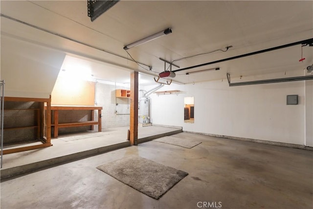 949 W Imperial Blvd Unit 14C, La Habra, CA 90631 - garage featuring a garage door opener and gas water heater