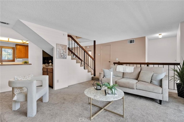 949 W Imperial Blvd Unit 14C, La Habra, CA 90631 - living room featuring light colored carpet, a textured ceiling, and stairway