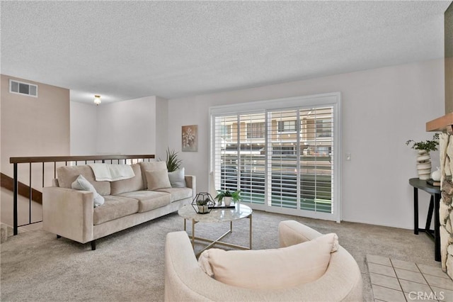 949 W Imperial Blvd Unit 14C, La Habra, CA 90631 - carpeted living room featuring a textured ceiling
