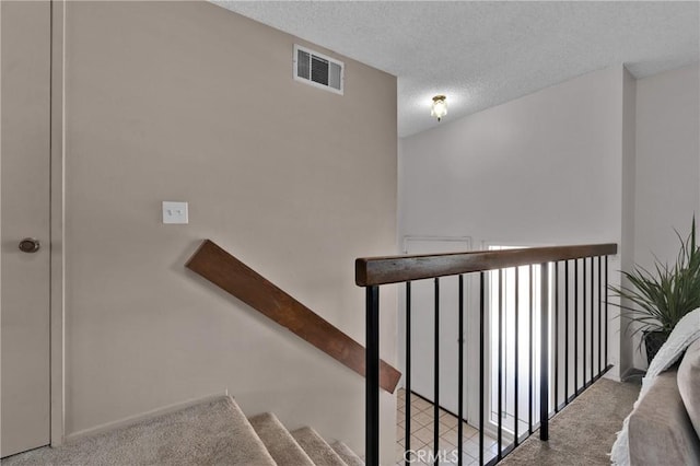 949 W Imperial Blvd Unit 14C, La Habra, CA 90631 - stairway featuring carpet and a textured ceiling