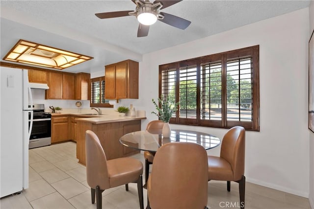 949 W Imperial Blvd Unit 14C, La Habra, CA 90631 - dining space featuring plenty of natural light, a textured ceiling, and ceiling fan