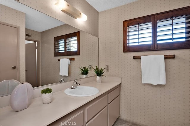 949 W Imperial Blvd Unit 14C, La Habra, CA 90631 - bathroom with healthy amount of natural light, vanity, and wallpapered walls