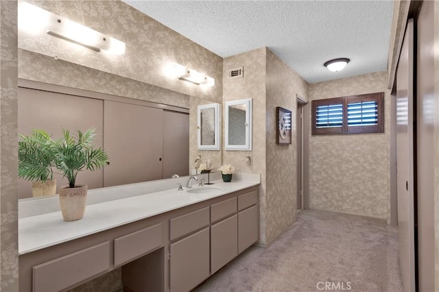 949 W Imperial Blvd Unit 14C, La Habra, CA 90631 - bathroom with vanity, wallpapered walls, and a textured ceiling