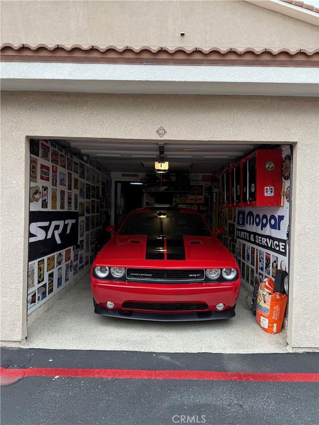 41410 Juniper St Unit 2012, Murrieta, CA 92562 - garage featuring a garage door opener