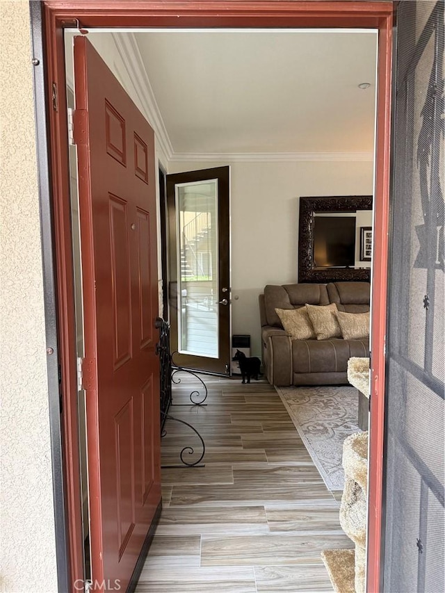 41410 Juniper St Unit 2012, Murrieta, CA 92562 - foyer featuring ornamental molding and light wood finished floors