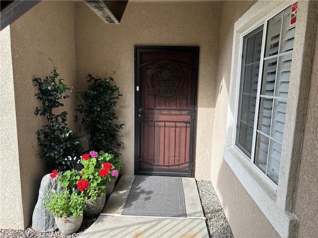 41410 Juniper St Unit 2012, Murrieta, CA 92562 - doorway to property with stucco siding