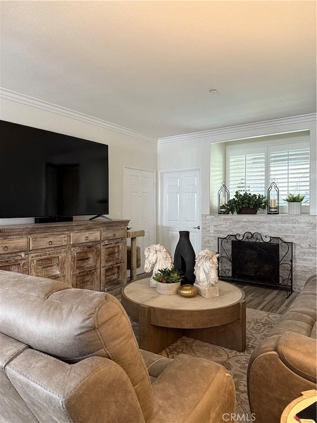 41410 Juniper St Unit 2012, Murrieta, CA 92562 - living area with crown molding, a stone fireplace, and wood finished floors