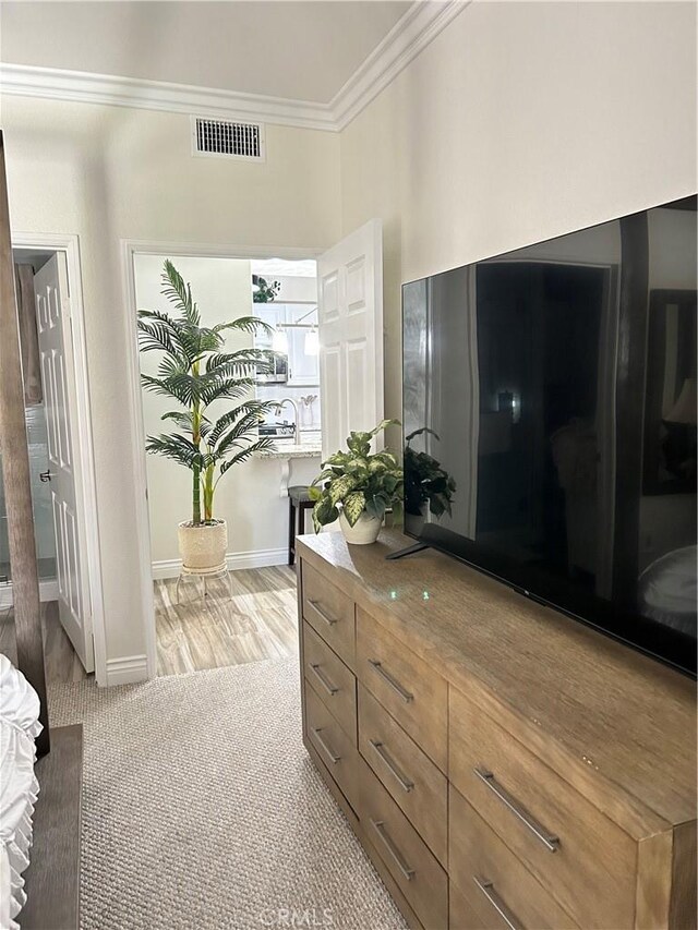 41410 Juniper St Unit 2012, Murrieta, CA 92562 - corridor with crown molding and light carpet