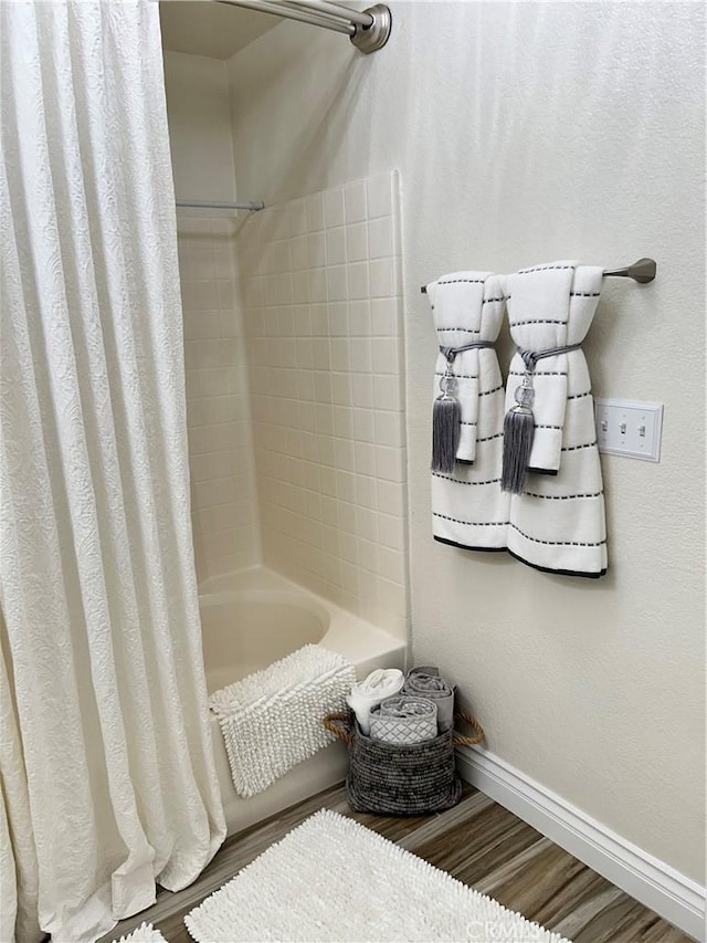 41410 Juniper St Unit 2012, Murrieta, CA 92562 - bathroom with shower / bath combo and wood finished floors