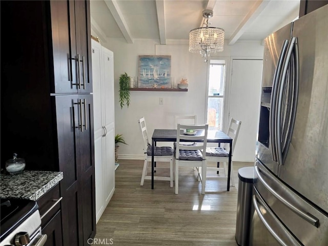 1707 Alta St, Redlands, CA 92374 - dining space featuring a chandelier, beam ceiling, wood finished floors, and baseboards