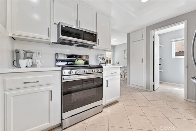 25421 Mina Ct, Lake Forest, CA 92630 - kitchen with appliances with stainless steel finishes, light countertops, white cabinetry, healthy amount of natural light, and recessed lighting