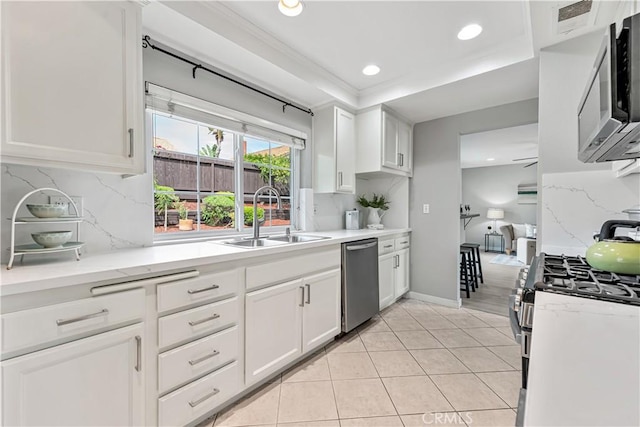 25421 Mina Ct, Lake Forest, CA 92630 - kitchen with stainless steel appliances, a sink, backsplash, recessed lighting, and white cabinetry