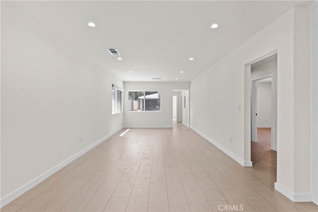 7714 Kyle St, Tujunga, CA 91042 - unfurnished living room featuring baseboards, light wood-style flooring, and recessed lighting