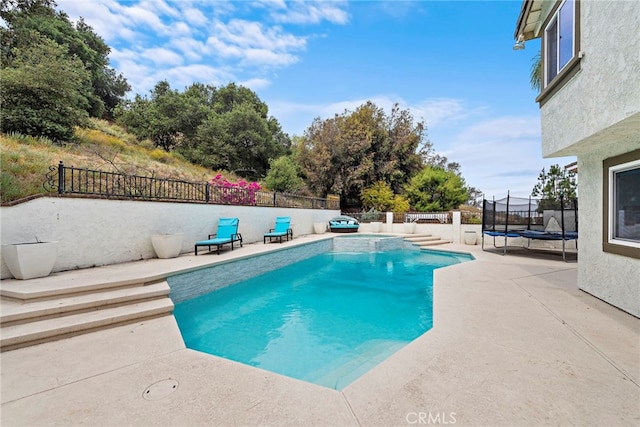 597 Rancheria Rd, Diamond Bar, CA 91765 - view of swimming pool featuring a trampoline, a patio area, and a fenced backyard