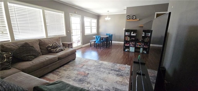 16701 Chatsworth St, Granada Hills, CA 91344 - living area with crown molding, a chandelier, wood finished floors, and baseboards
