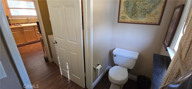 16701 Chatsworth St, Granada Hills, CA 91344 - bathroom featuring toilet, wood finished floors, vanity, and baseboards