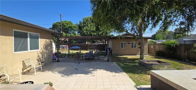 16701 Chatsworth St, Granada Hills, CA 91344 - view of patio featuring a pergola, outdoor dining space, and an outbuilding
