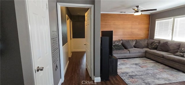 16701 Chatsworth St, Granada Hills, CA 91344 - living area with dark wood-type flooring, a ceiling fan, and wood walls