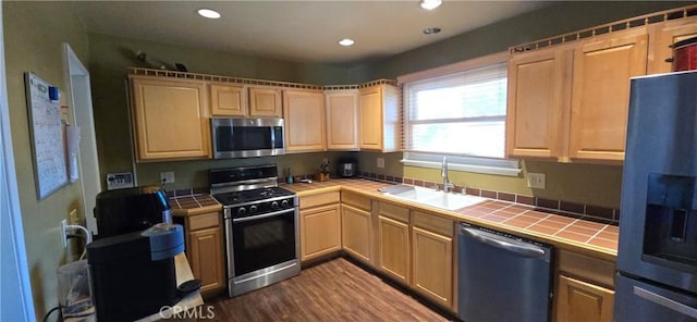 16701 Chatsworth St, Granada Hills, CA 91344 - kitchen with tile countertops, appliances with stainless steel finishes, a sink, dark wood-type flooring, and recessed lighting