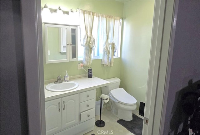 16701 Chatsworth St, Granada Hills, CA 91344 - bathroom with toilet, vanity, and tile patterned floors