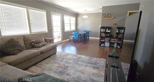 16701 Chatsworth St, Granada Hills, CA 91344 - living room featuring a chandelier, wood finished floors, crown molding, and baseboards