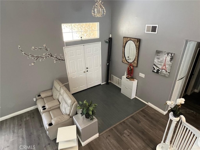 12413 Redrock Rd, Victorville, CA 92392 - entryway featuring baseboards, dark wood-type flooring, and a chandelier