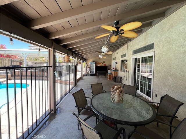 12413 Redrock Rd, Victorville, CA 92392 - fenced backyard featuring a patio, ceiling fan, and outdoor dining area